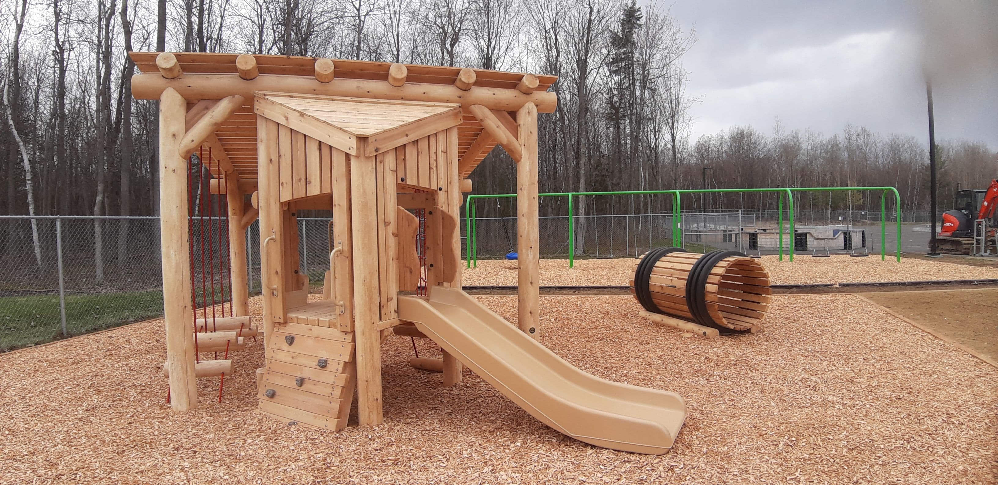 Wooden playground structure by Westplay