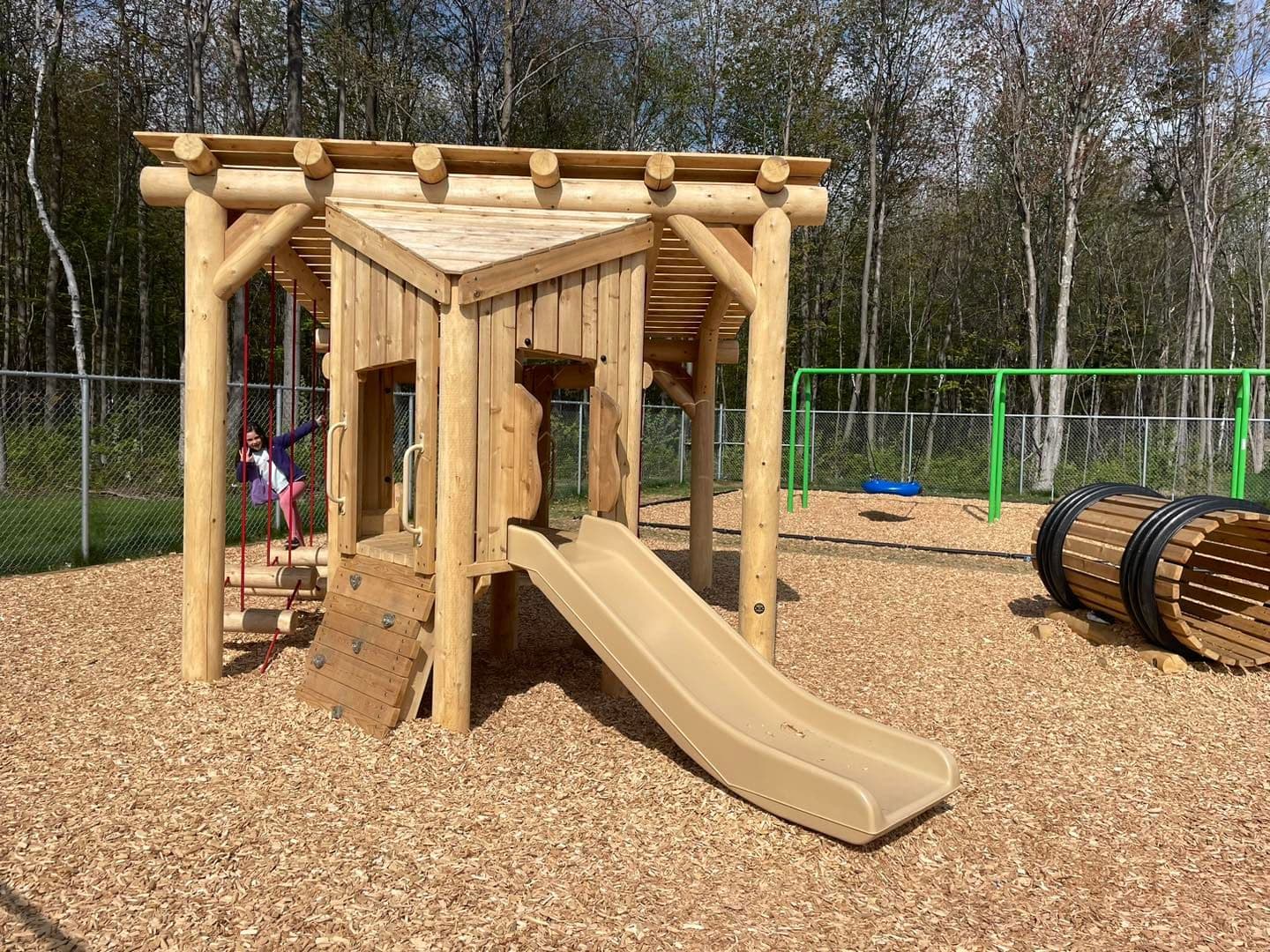 Wooden playground structure by Westplay
