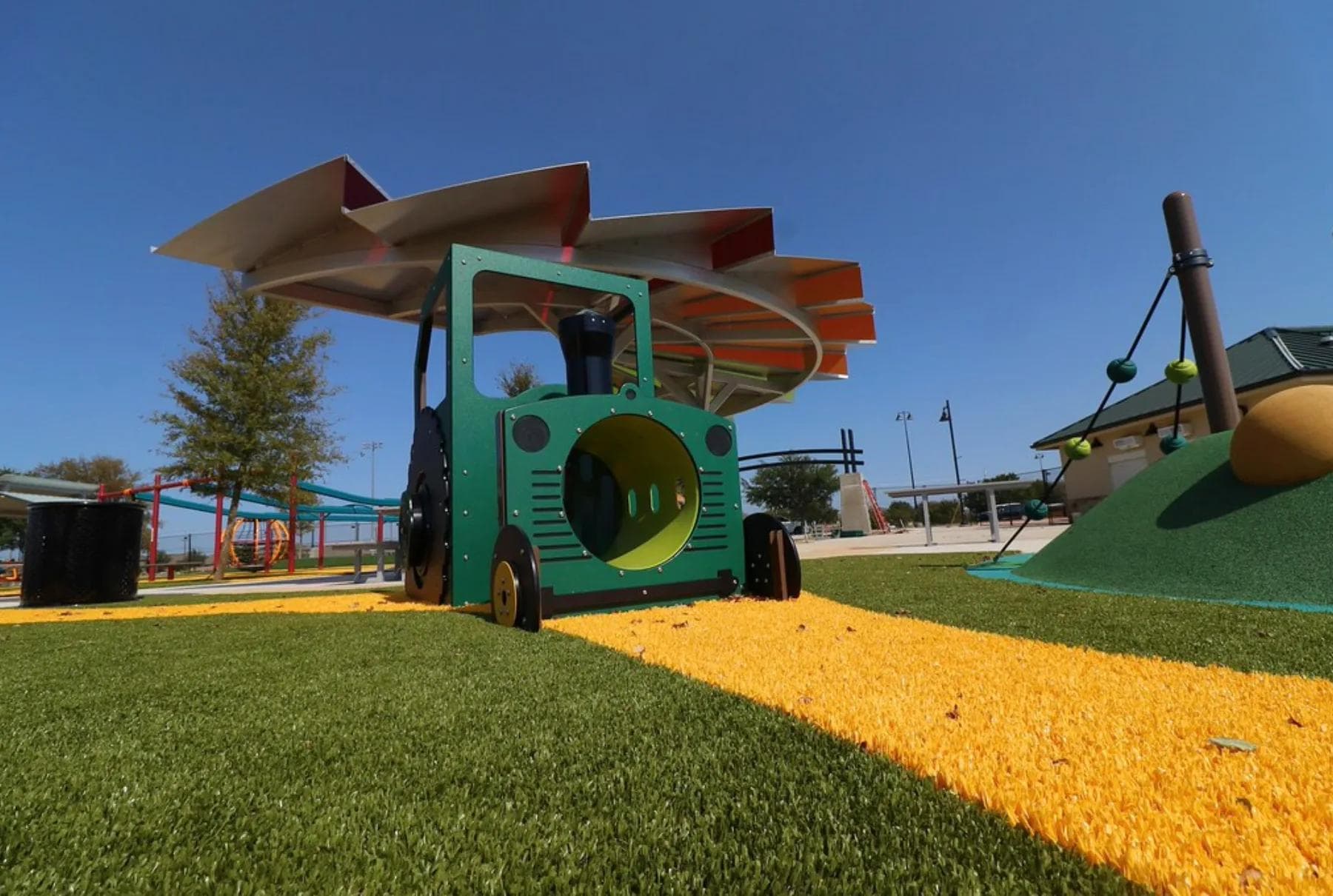 Synthetic playground grass surfacing installed by Westplay